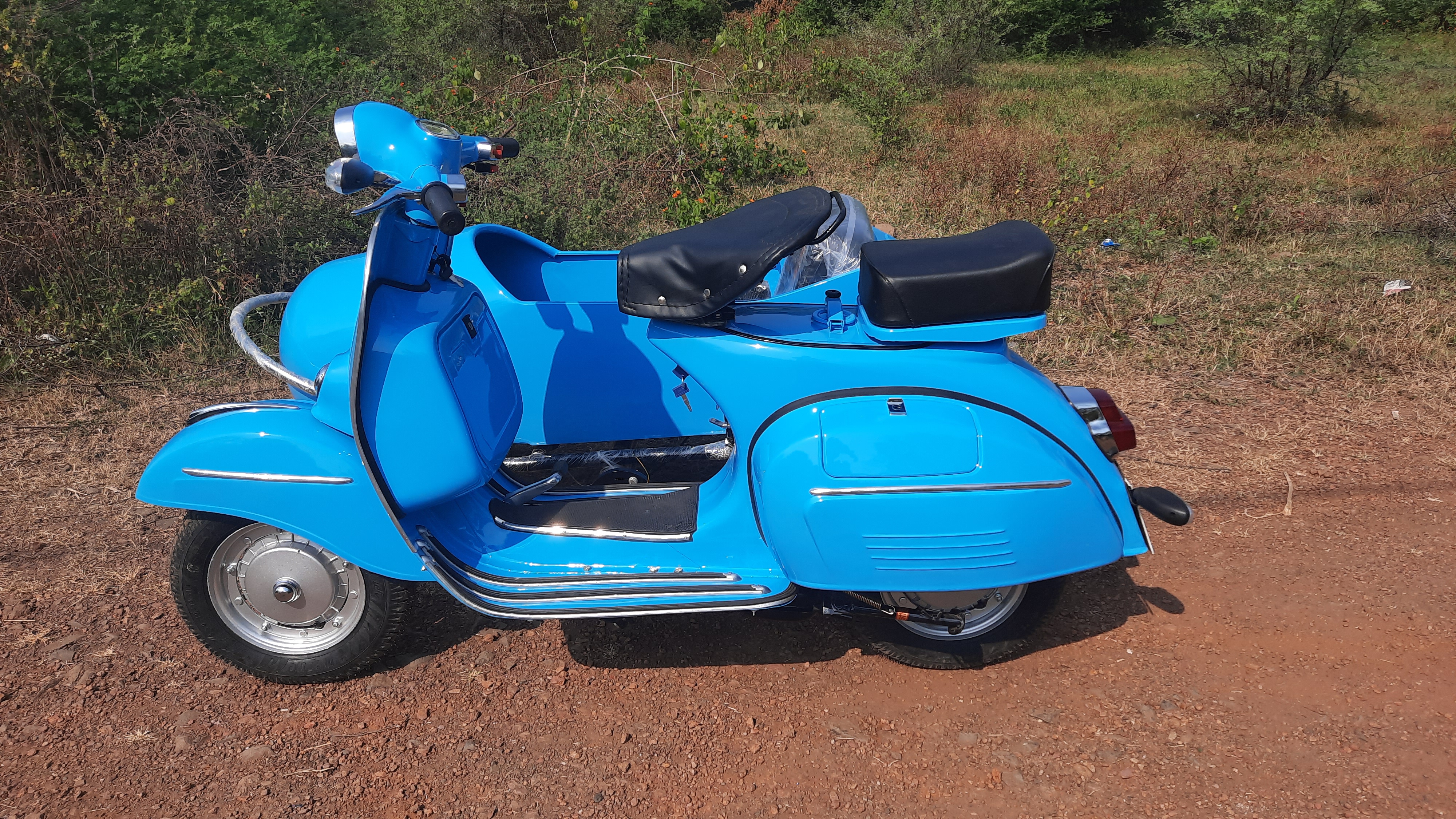 Three-quarter view showing both scooter and sidecar